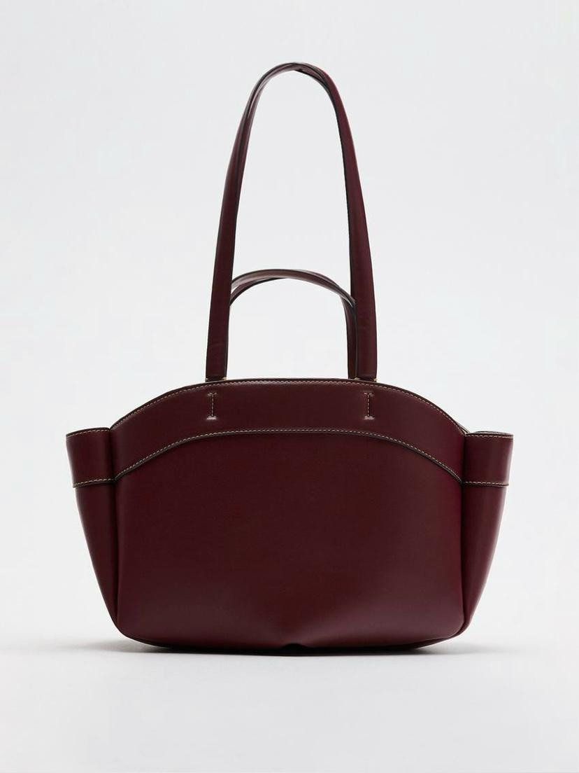 Bolso de piel con asa